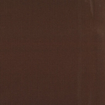 Medium-brown fabric texture with granular surface, displaying a dense, velvety weave and a “turri > fabric cat. x > 657 g” label.